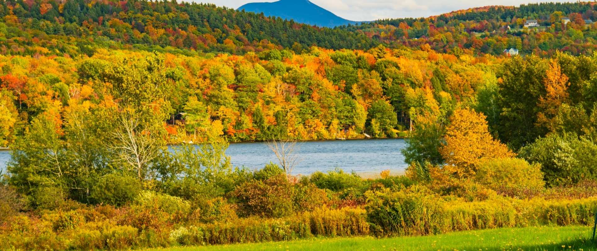Lake Iroquois surrounded by fall foliage and rolling hills near Williston, VT