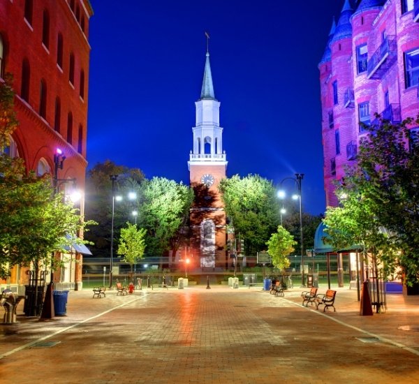 Tree-lined Church Street in Burlington, VT at night